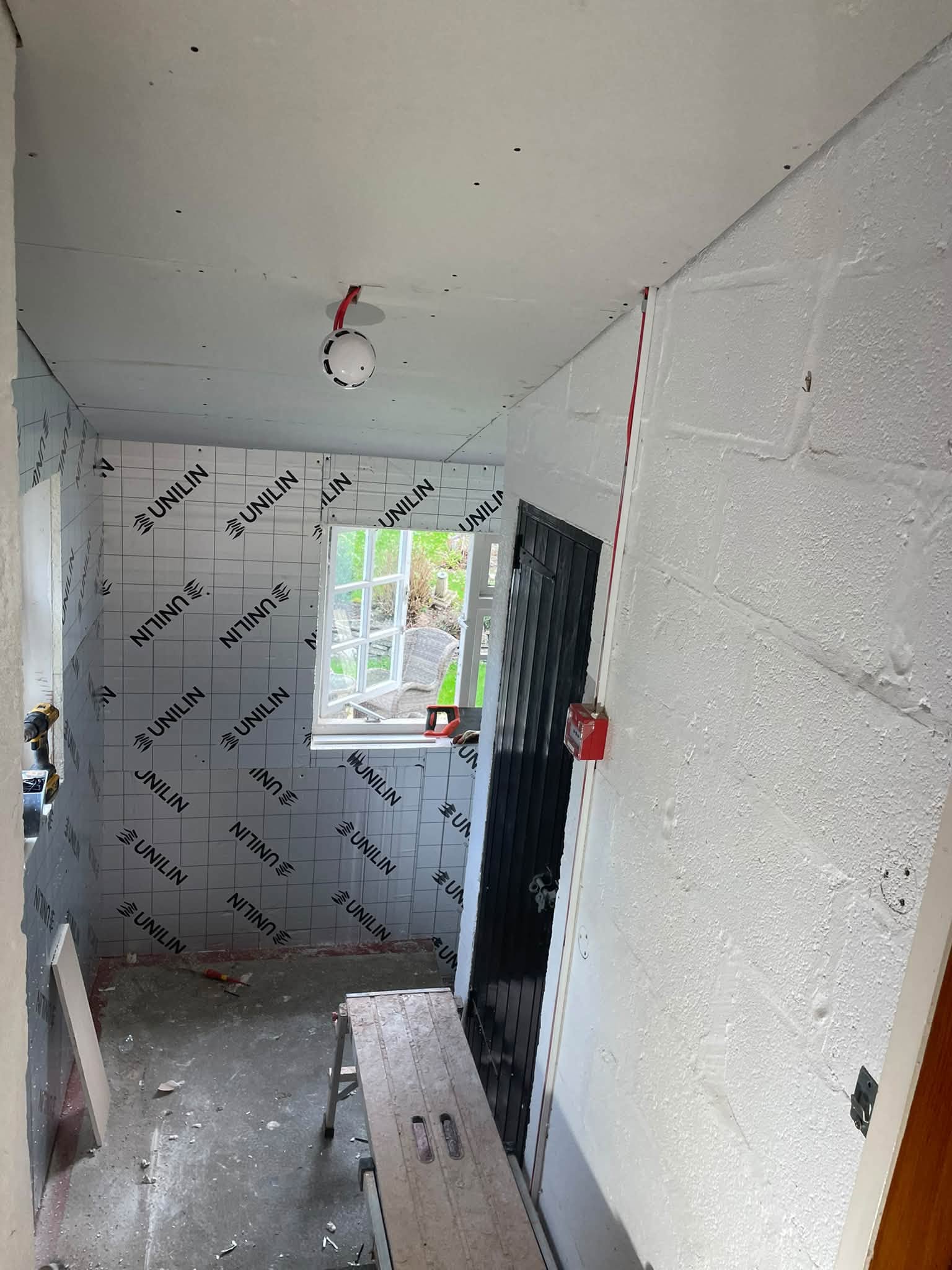 Room lined with insulation boards before plastering