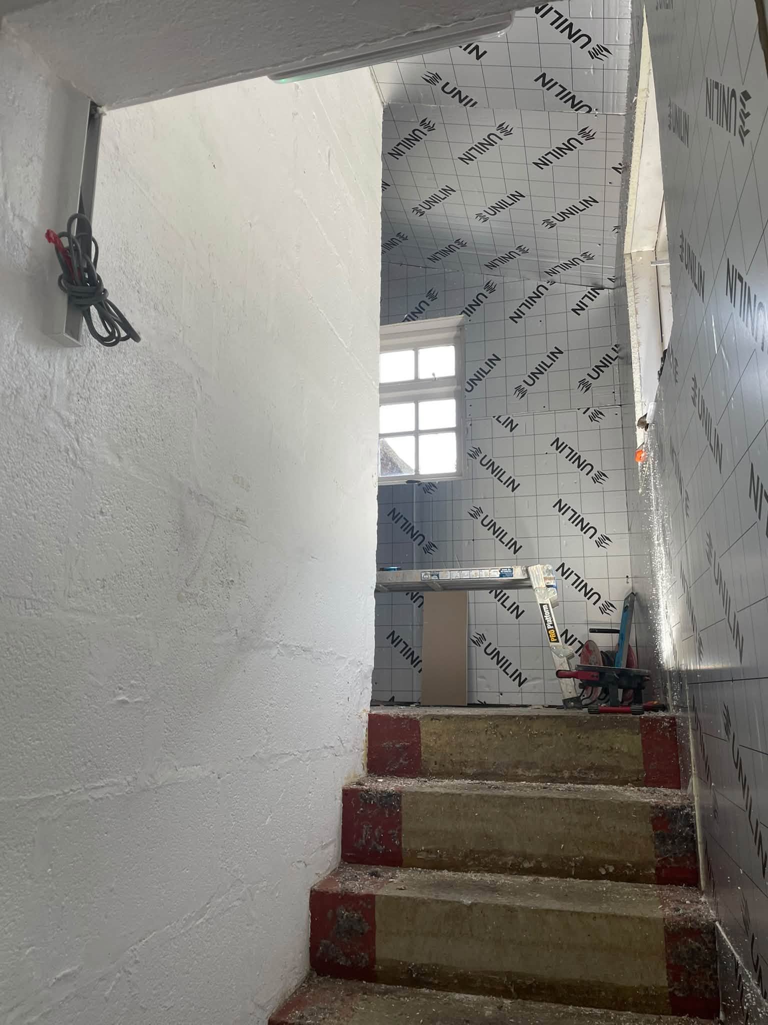 Stairwell lined with insulation boards before plastering